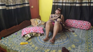 Indian young lady peeing in bed and squirting herself with diido
