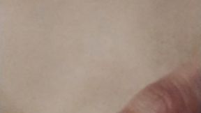 Squeezing my juicy nipple