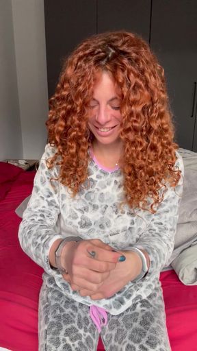 Redhead gets handcuffed in bondage