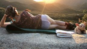 Diaper girl posing outdoors with sunset