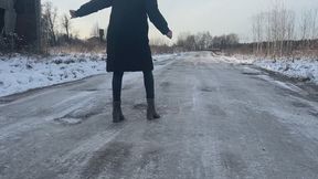 A girl in high-heeled boots decided to walk along the road, but her shoes slipped very much on the ice, so she sometimes even fell