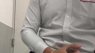Man masturbating in office bathroom