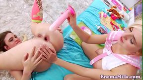 Enema lesbians dildoing their gaping asses