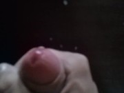 Russian skinny guy jerks off a big cock in front of the mirror and cums on the table