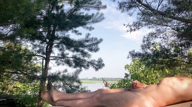 A warm breeze gently blows over him, and he smoothly moves the skin on his cock...