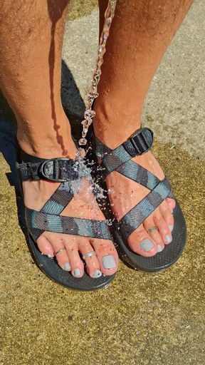 Cleaning off my pedicured feet and dirty sandals after a long hike