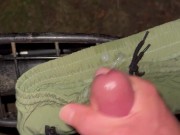 Cumming in park on bike and short
