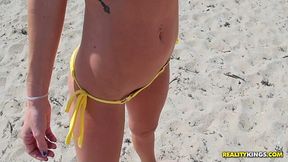 Tight blonde strumpet brags with her body on the beach