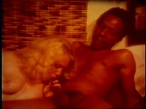 Blonde sucks a big black cock in the seventies