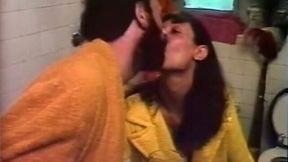 Bearded guy feeds his brunette girlfriend with dick in the bathroom
