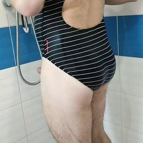 Boy wearing Speedo swimsuit and jerking