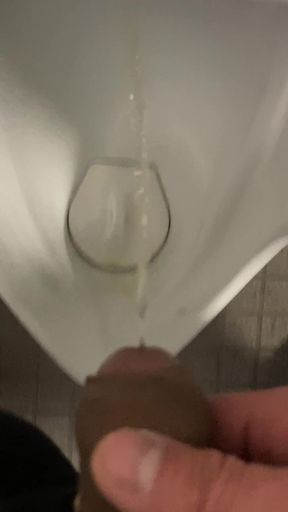 guy pissing in urinal