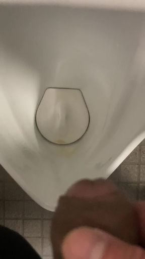 guy pissing in urinal