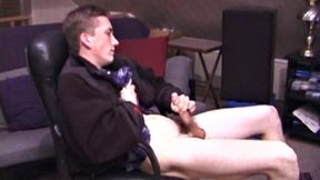 When Derek pulls down the pants his hard cock pops out and he begins stroking it. He obviously enjoys the porn video playing, because Derek soon pumps his warm cum onto his belly.