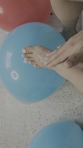 Creamy bare feet popping balloons