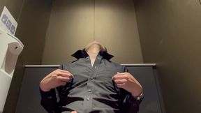 Nipple masturbation in a public restroom
