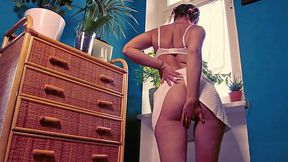 Italian MILF masturbating with dildo by the window