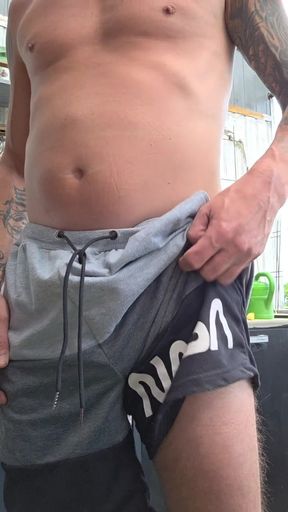 Daddy plays with his cock on the balcony and cums.