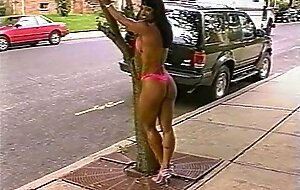 Fitness girl showing off great body outdoors