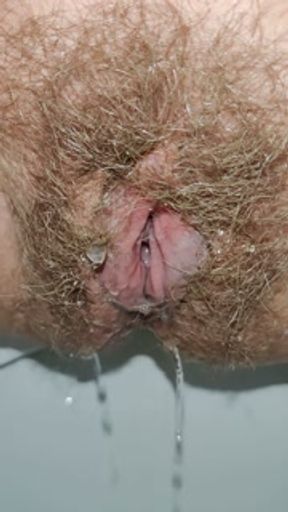 Long piss after huge holding pee. Hairy Pussy zoomed mega close up