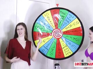 three very marvelous angels play a game of disrobe spin the wheel
