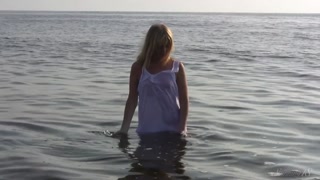 Divine Blonde Teen Blissfully Naked in the Sea
