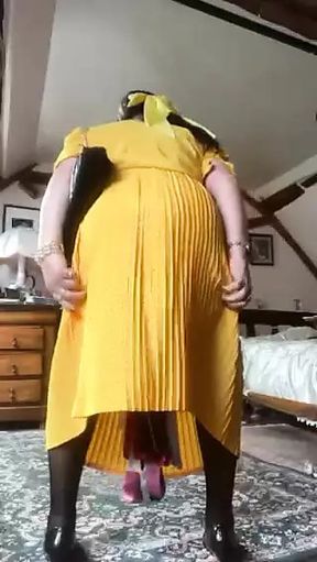 In yellow dress with polka dots