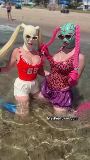 Curvy Lola Noir enjoys a beach day in latex with her partner