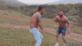 Sporty guys having sex countryside