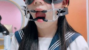 A beautiful and lovely Asian girl had her mouth stretched open and kept drooling.