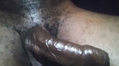 A big-dicked black guy gets a handjob from his horny partner