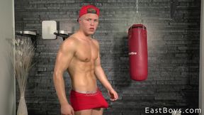 Peter Homely pouts at the camera while showing his muscles