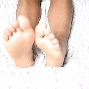 Luscious feet on a beautiful white sheet