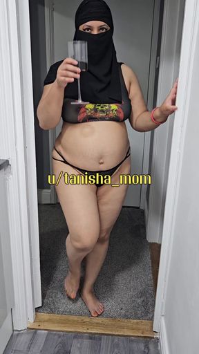 Curvy Middle Eastern amateur with big tits stands in her bedroom
