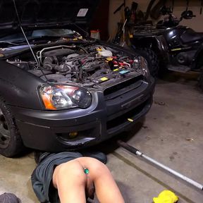 Slutty mechanic in the shop with a plug in his ass