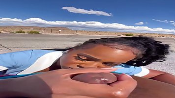 Ebony MILF Ny Ny Lew sucks black dick in the middle of the desert