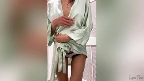 Fit girl tries on satin lingerie and dresses in a public changing room