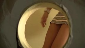 Sexy brunette, Gracie Glam, is interrupted in a bathroom by a huge cock popping through a...