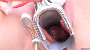 Kinky brunette is spreading her pink pussy wide to show how deep it can be