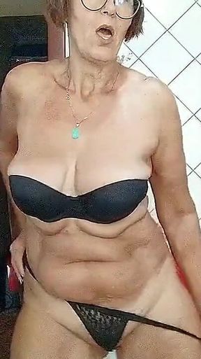 Lonely Hostess in the Kitchen Shows the Beauty of Her Old Sexy Body in Front of a Webcam
