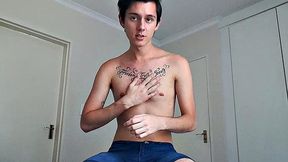 Ant is a slim and smooth twink, with that boy next door look, until the shirt peels off revealing an inked chest. He pushes his shorts down just enough to give us a peek at his fine looking little butt and big uncut cock.