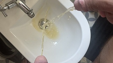 2 amateur boys flatmates (1 ginger, circumcised, with undies and flip flops, 1 naked uncut) pissing together in a bidet