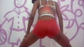 Lean ebony hood girl shakes her tight butt in red shorts