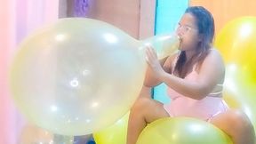 Sexy Juju Blows To Pop 2 Big Balloons While Riding A Huge Yellow Doll Balloon