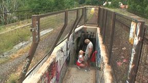 He fucks the blonde girl and cums in his mouth near the train tracks