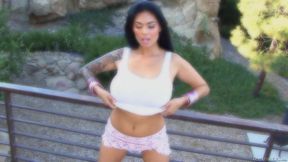 Tera Patrick slowly strips outdoors