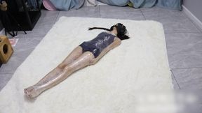 GG115-Swimsuit, twin ponytails, barefoot, Asian girl, bound by plastic wrap. Challenging herself to break free.