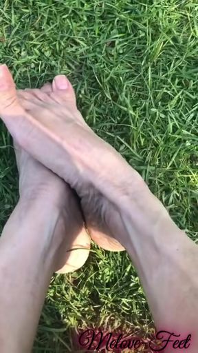 Melove Showing her sexy small feet on green grass