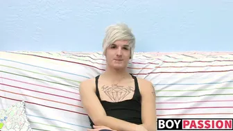 Tattooed twink Austin jerks his big cock in solo masturbation