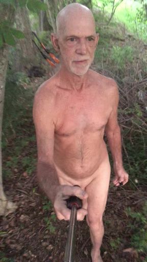 Behind my house in the woods walking around naked